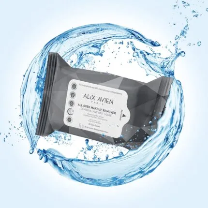 A close-up of a biodegradable makeup wipe removing waterproof mascara from an eye.