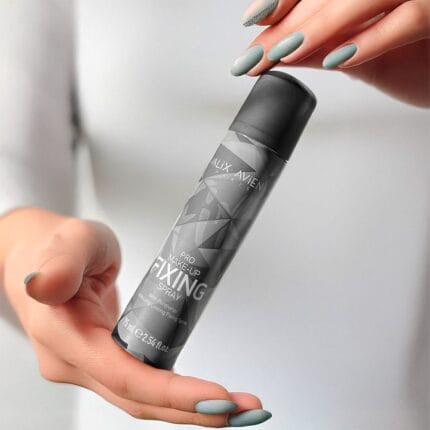 A model misting her face with the refreshing Make-Up Fixing Spray over flawless makeup.